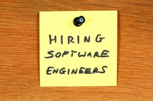 "Hiring software engineers" on sticky note.
